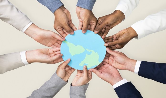 Hands holding earth CSR business campaign